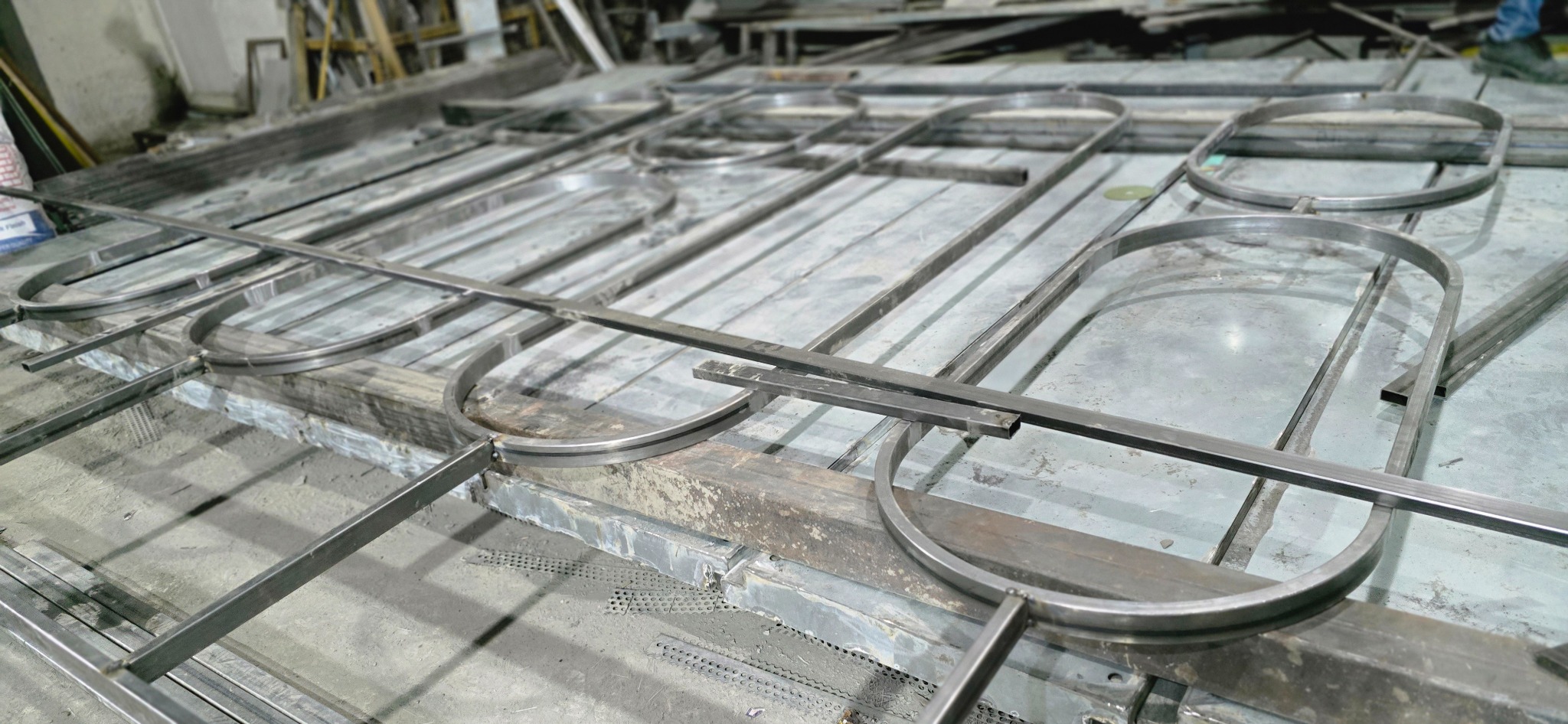 Metal capsule frames laid out for fabrication